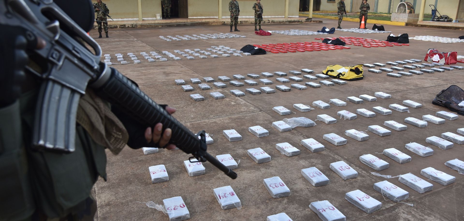 Members of Bolivia's Special Fighting Force Against Drug Trafficking (FELCN) guard 582 kg of cocaine hydrochloride, seized from a ranch -where allegedly was due to be refined- in the locality of Guayaramerin, in the norteastern border with Brazil, on April 17, 2018.