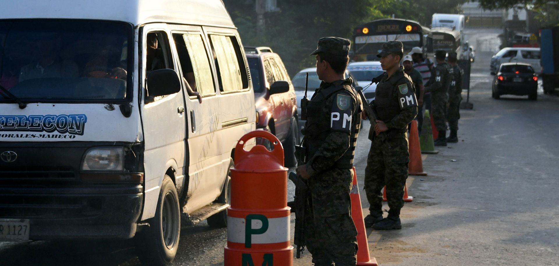 A military police checkpoint in November 2017 in San Pedro Sula, Honduras. The underlying condition that enables the extreme violence of the country's homicide highways is the region's geography.