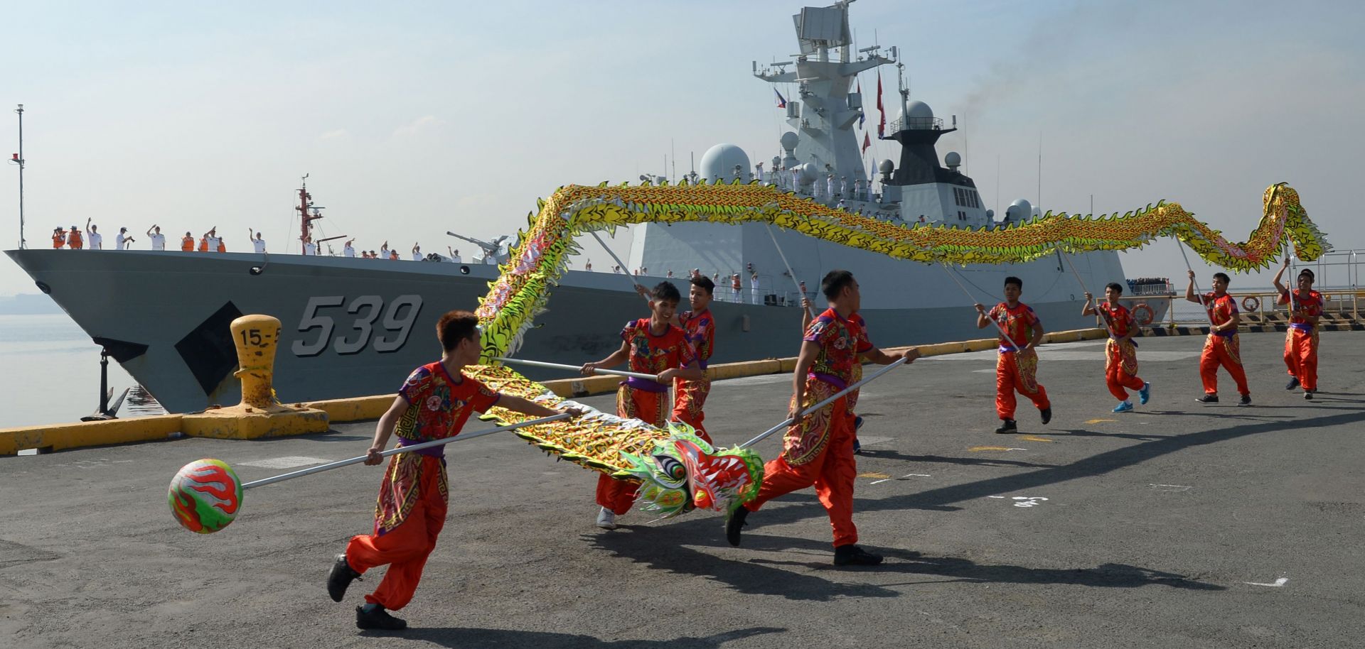 Dragon dancers perform as the Chinese guided-missile frigate Wuhu visits Manila, Philippines, in January 2019.