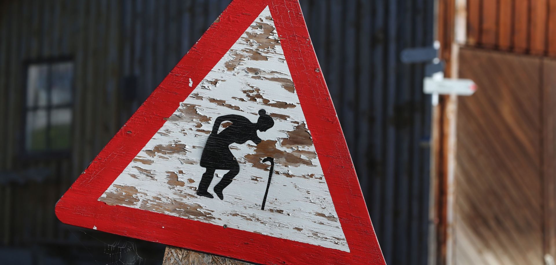 A warning sign requests to give priority to elderly people at a farm in Unterjoch, southern Germany, on October 9, 2018.