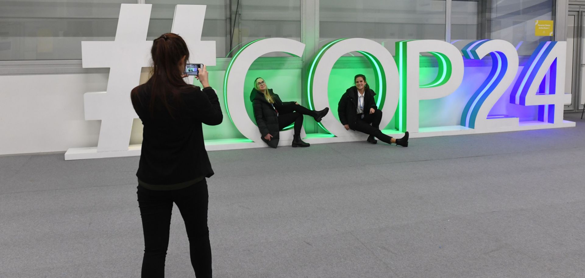 Participants pose for a picture during the final session of the COP24 summit on climate change in Katowice, Poland, on Dec. 14, 2018.