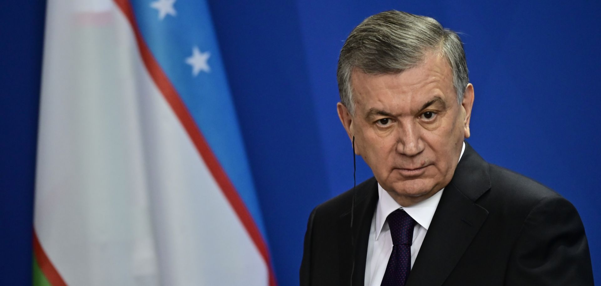 Uzbek President Shavkat Mirziyoyev listens during a joint press conference with German Chancellor Angela Merkel prior to a meeting on Jan. 21, 2019, in Berlin.