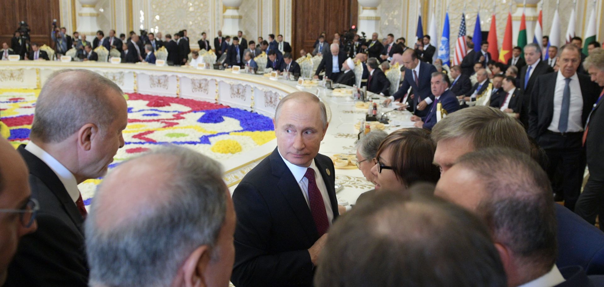 Russian President Vladimir Putin (center) listens to his Turkish counterpart Recep Tayyip Erdogan (left) at the 2019 Conference on Interaction and Confidence-Building Measures in Asia (CICA) in Dushanbe, Tajikistan. 