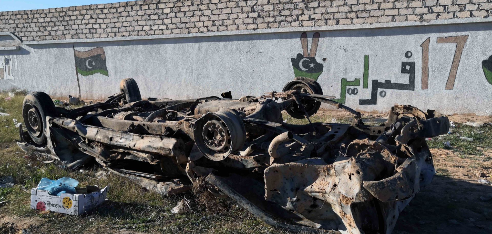 This Dec. 26, 2019, photo shows a damaged vehicle in the wake of an airstrike in Zawiya, 45 kilometers west of Tripoli.