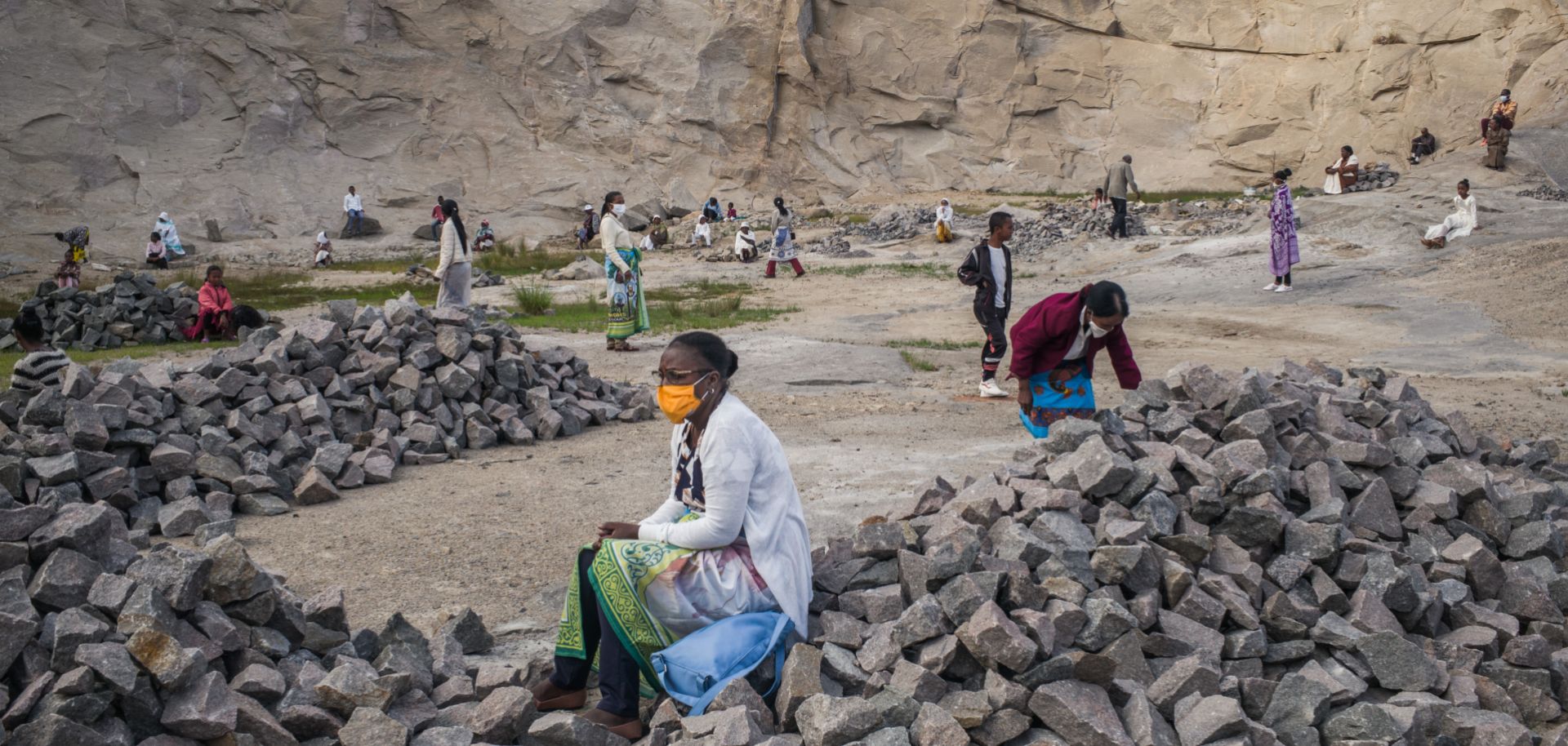 People wearing masks gather in a granite quarry in Antananarivo, Madagascar, for an Easter celebration while practicing social distancing on April 12, 2020. The capital city has been on lockdown since March 23 to curb the spread of COVID-19.