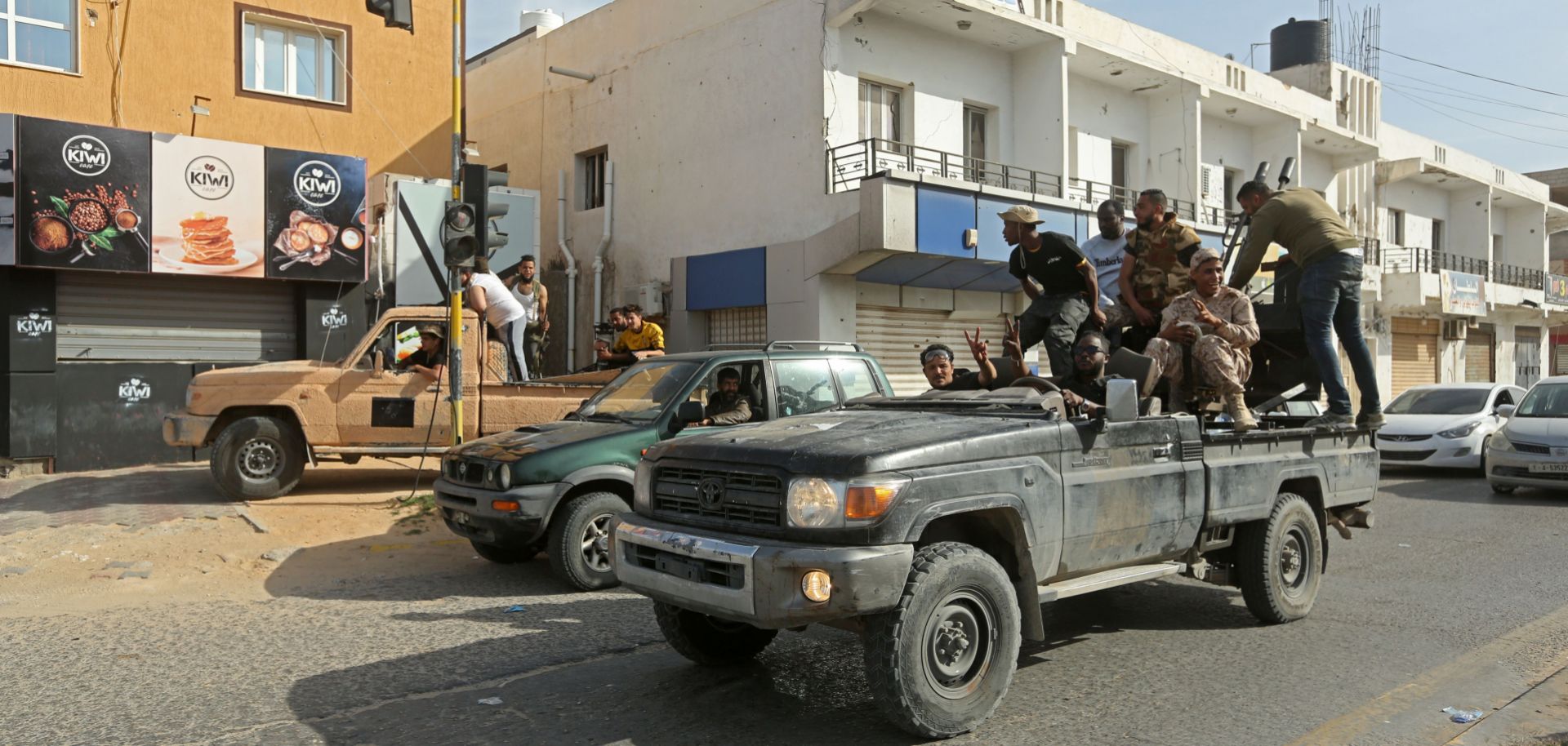 Fighters loyal to the U.N.-recognized Government of National Accord (GNA) celebrate in Sabratha, Libya, after seizing the coastal city from Khalifa Hifter’s rebel troops on April 13, 2020.