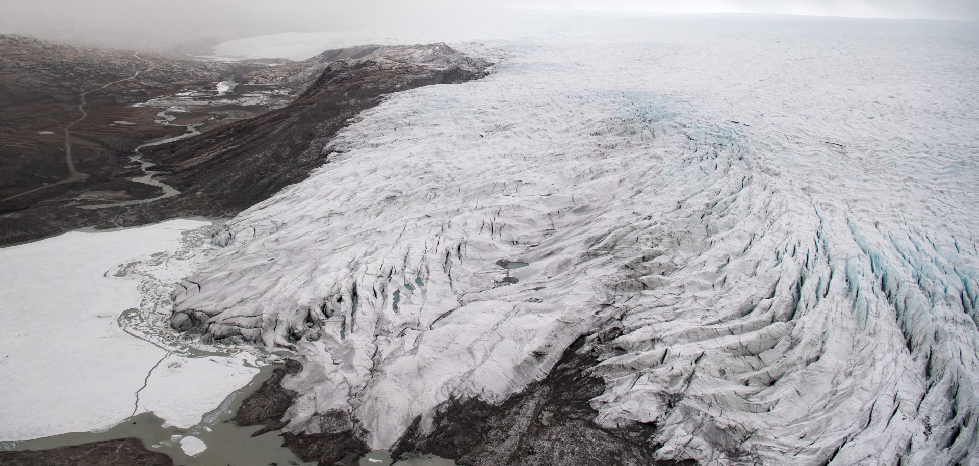 A photo taken during a helicopter tour with U.S. Secretary of State Antony Blinken shows ice receding from a glacier near Kangerlussuaq, Greenland, on May 20, 2021. 