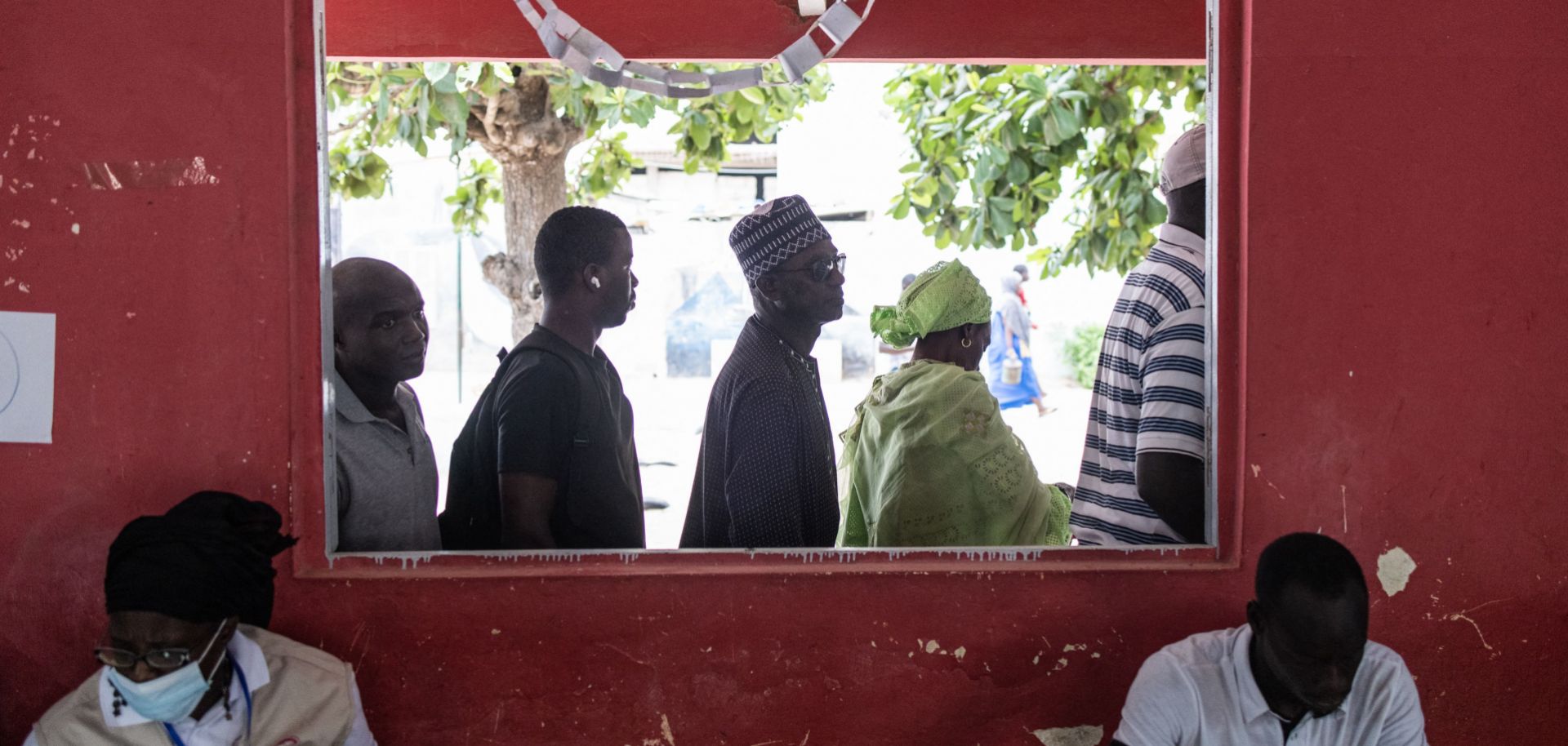 People wait to vote in Senegal’s legislative election outside a polling station in Dakar on July 31, 2022.