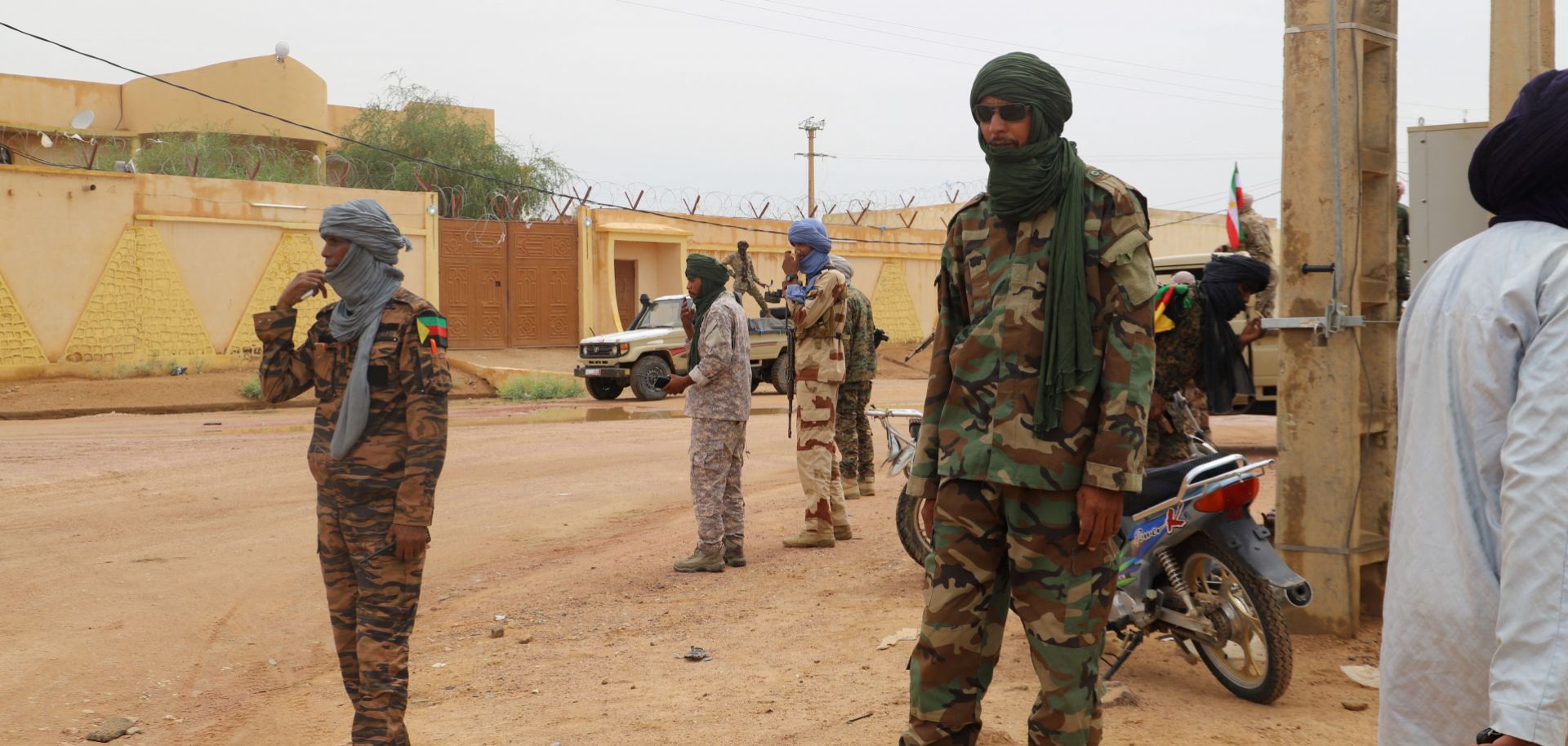 Fighters aligned with the National Movement for the Liberation of Azawad (MNLA) patrol a street in Kidal, northern Mali, on Aug. 28, 2022. 