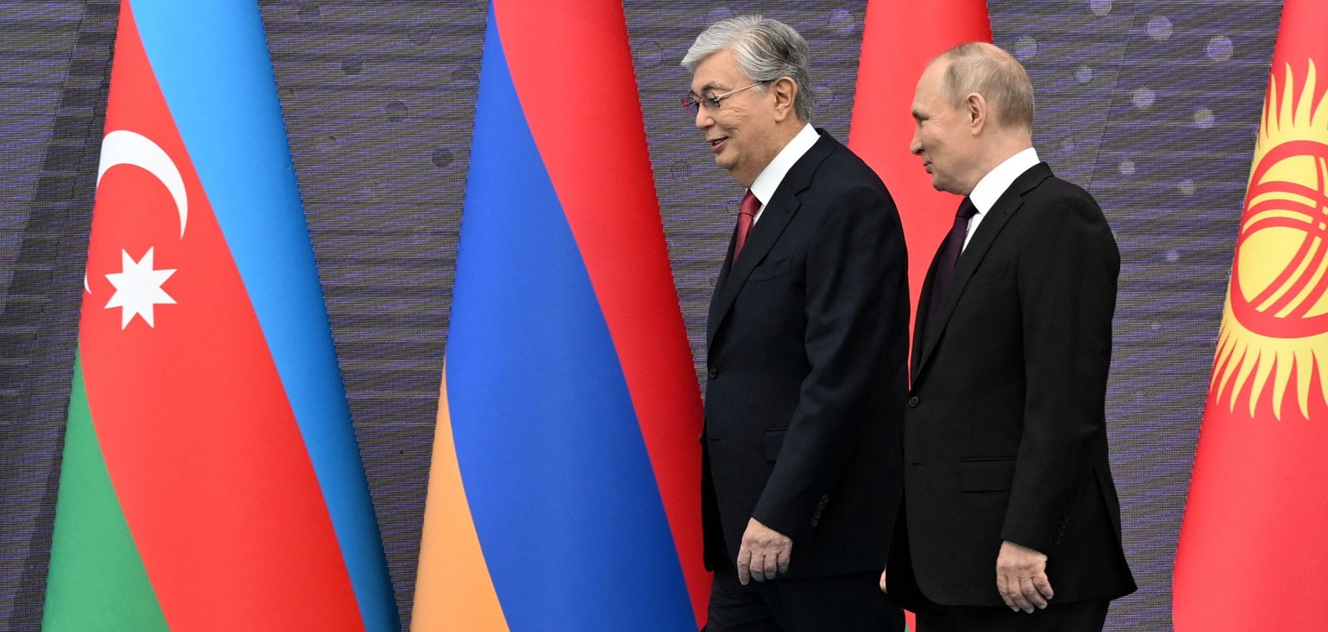 Russian President Vladimir Putin (right) and his Kazakh counterpart Kassym-Jomart Tokayev arrive in Astana before a regional summit on Oct. 14, 2022. 