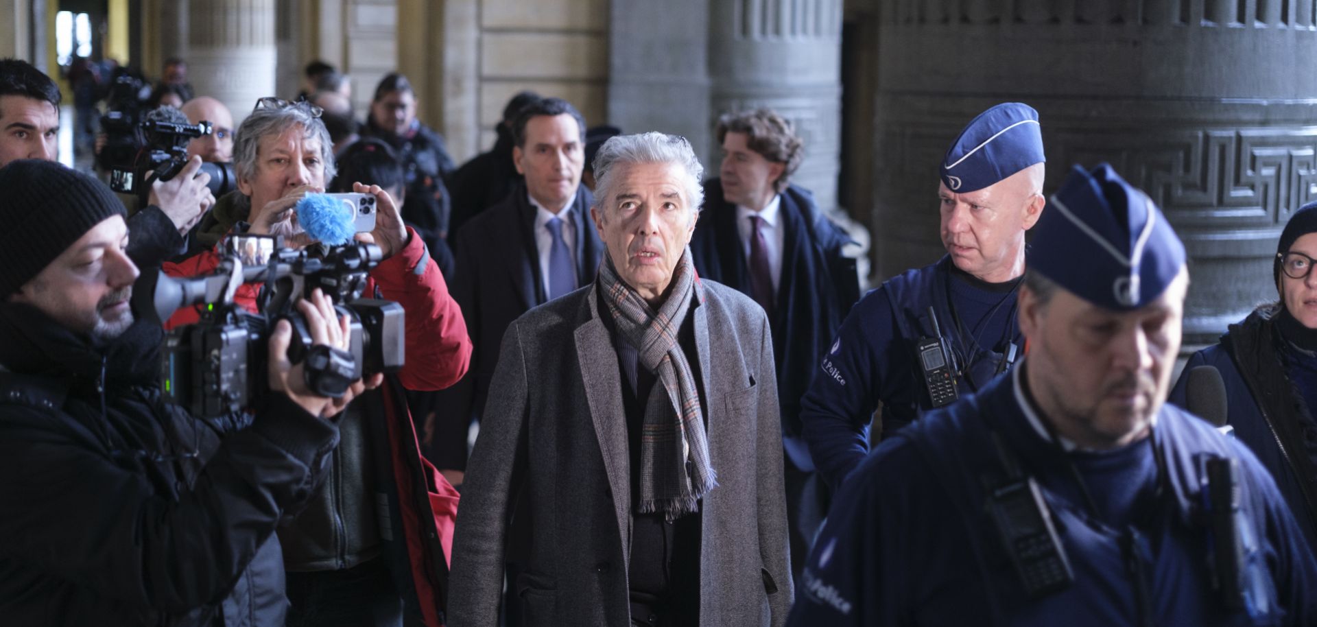 Journalists surround one of the lawyers (front) representing former European Parliament Vice-President Eva Kaili, who has been charged in a corruption investigation involving Qatar, at a courthouse in Brussels, Belgium on Dec. 22, 2022.