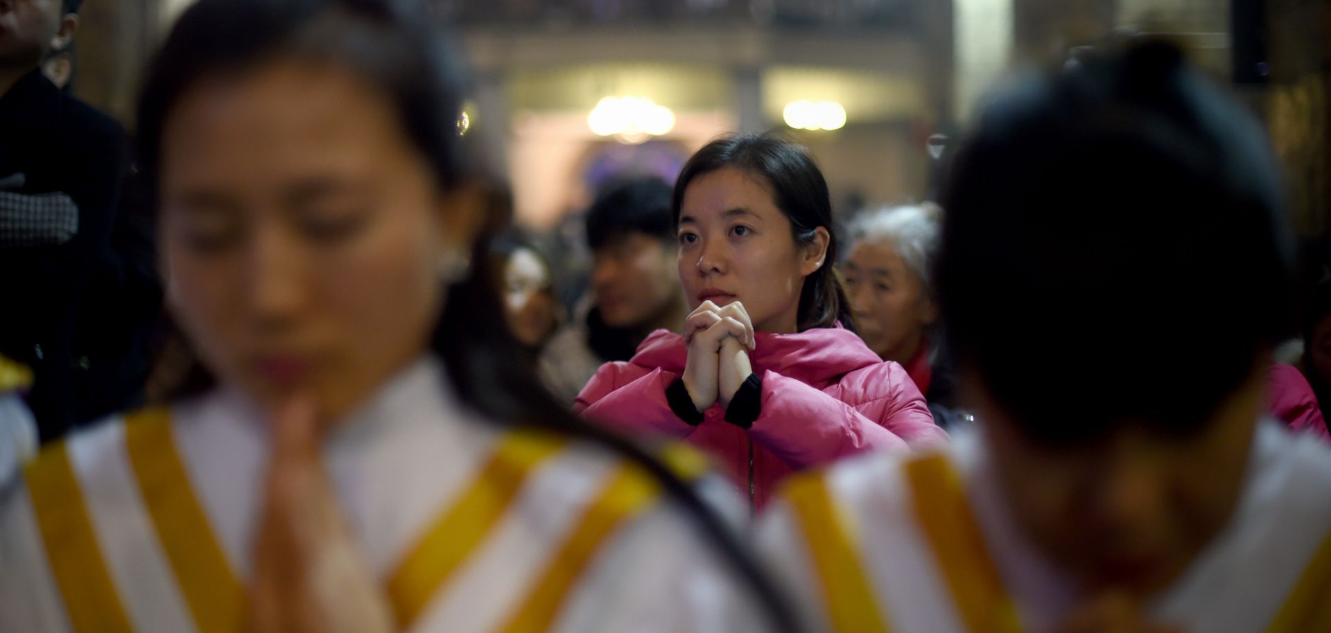 Chinese worshippers attend Christmas Eve Mass at a Catholic church in Beijing during 2015.