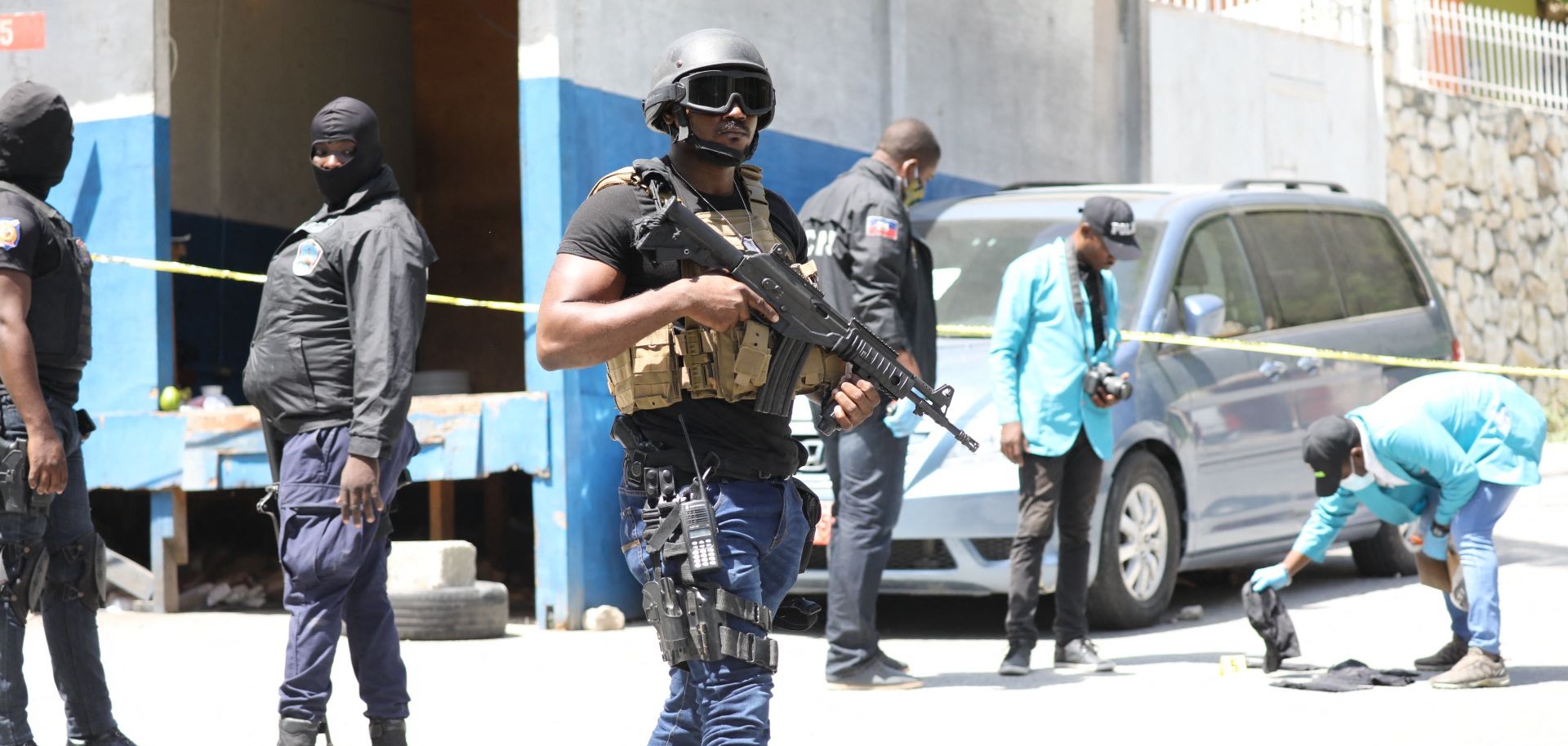 Haitian security forces look for evidence outside of President Jovenel Moise’s residence in Port-au-Prince following his assassination on July 7, 2021. 