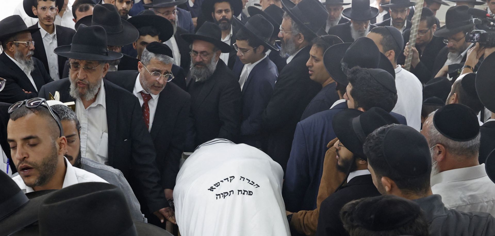 Mourners attend the funeral of Yaakov Shalom, one of the five people killed in yesterday's shooting attack in the religious town of Bnei Brak, at the Yarkon cemetery in the Israeli city of Petah Tikva on March 30, 2022.