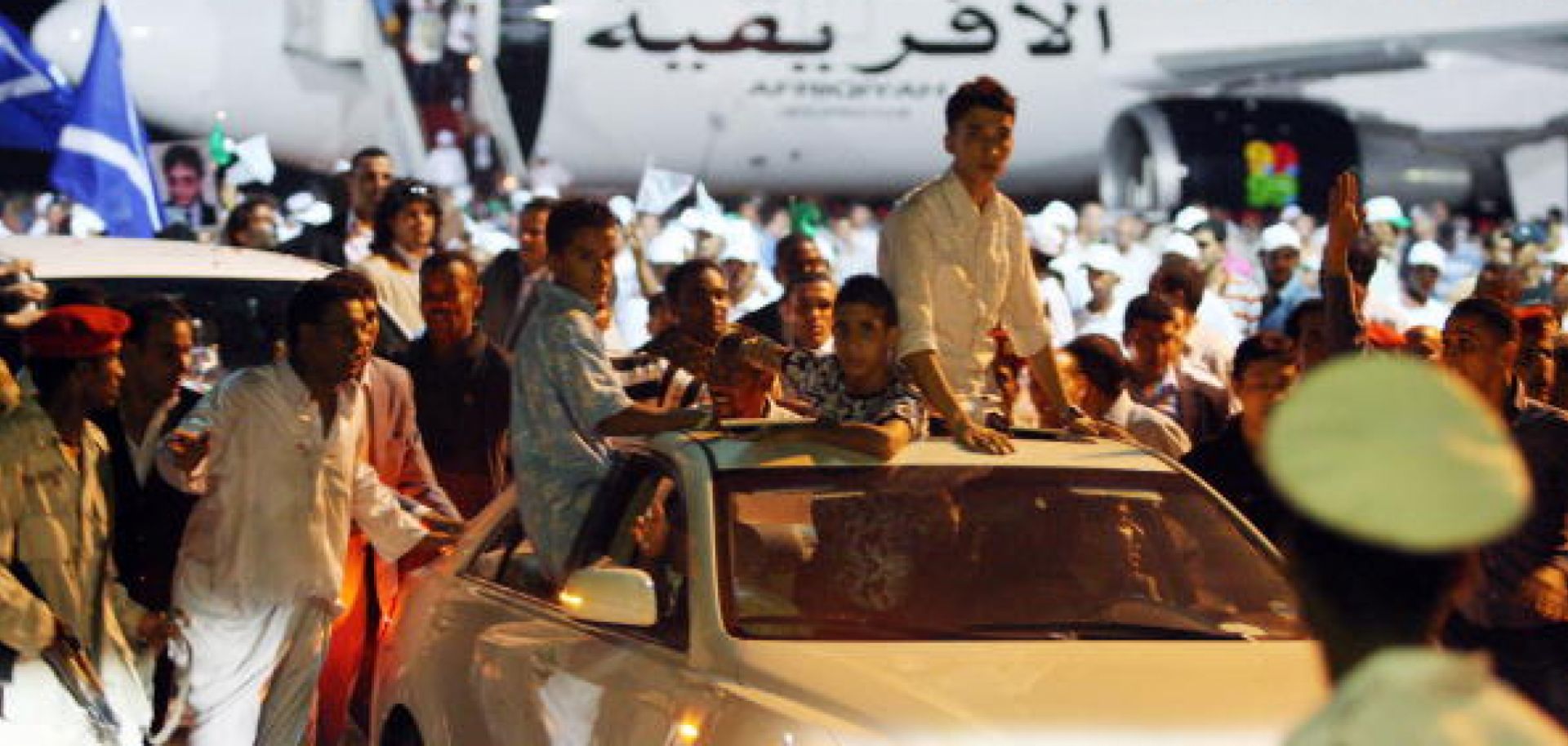Libyans attend a welcoming ceremony for freed Lockerbie bomber Abdel Basset Ali al-Megrahi (not seen) upon his arrival in Tripoli late on August 20, 2009.