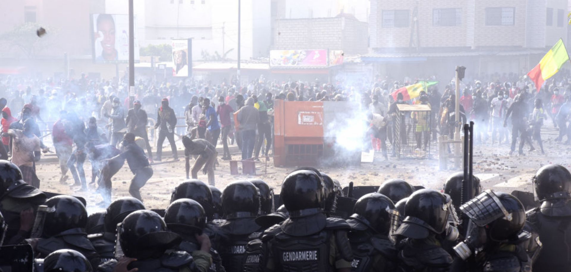 Protesters fight gendarmes on March 5, 2021, near their barracks in the Colobane neighborhood in Dakar, Senegal, during clashes following the arrest of the main opposition leader, Ousmane Sonko. 