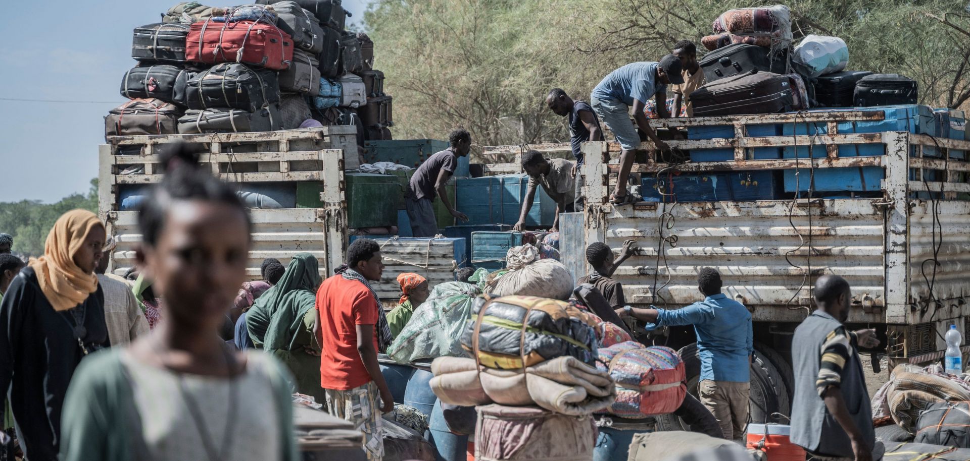 Workers load luggage onto a vehicle that belongs to refugees from Sudan who entered Ethiopia in Metema on May 5, 2023.