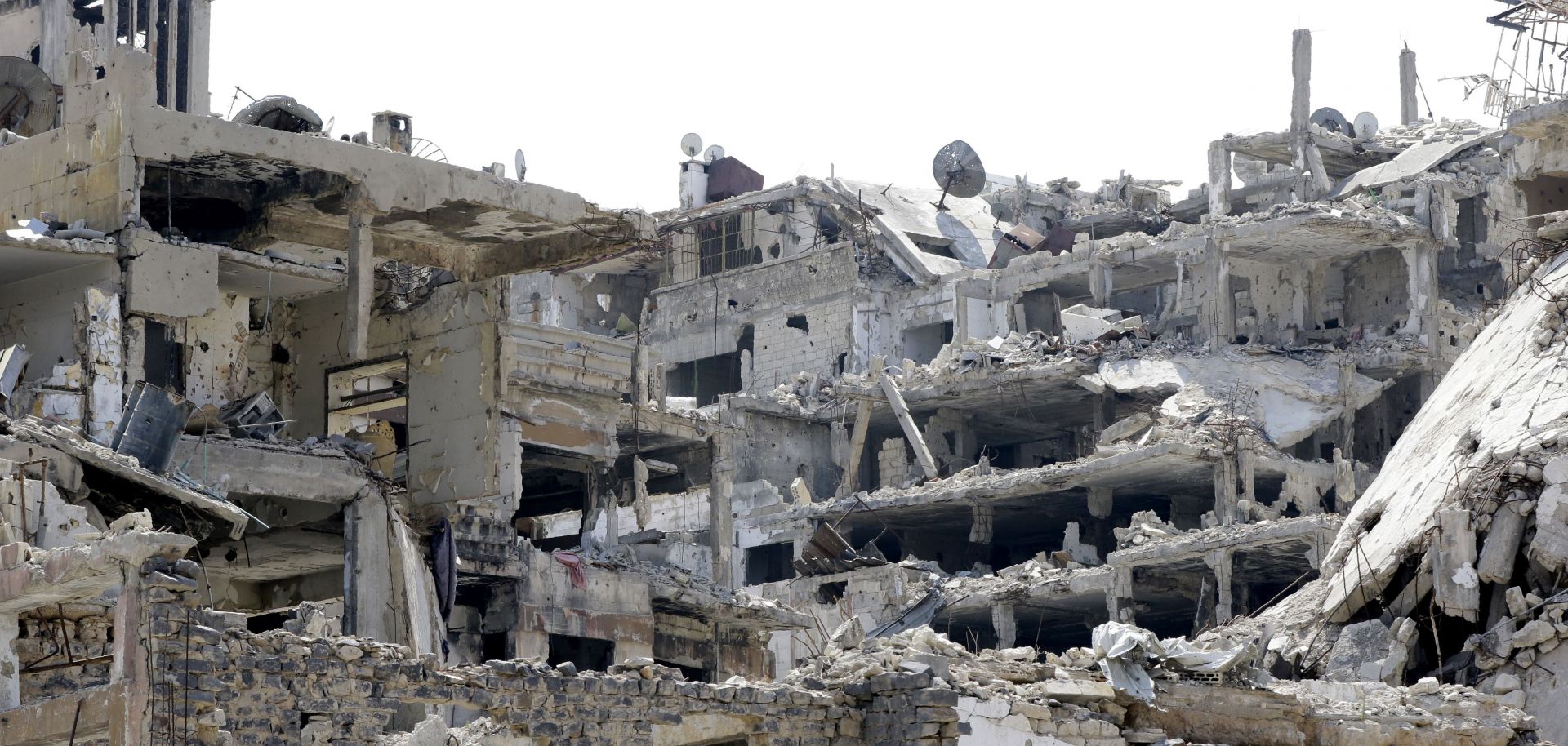 This Aug. 14, 2016, picture shows heavily damaged buildings in the al-Khalediah neighborhood of the central Syrian city of Homs.