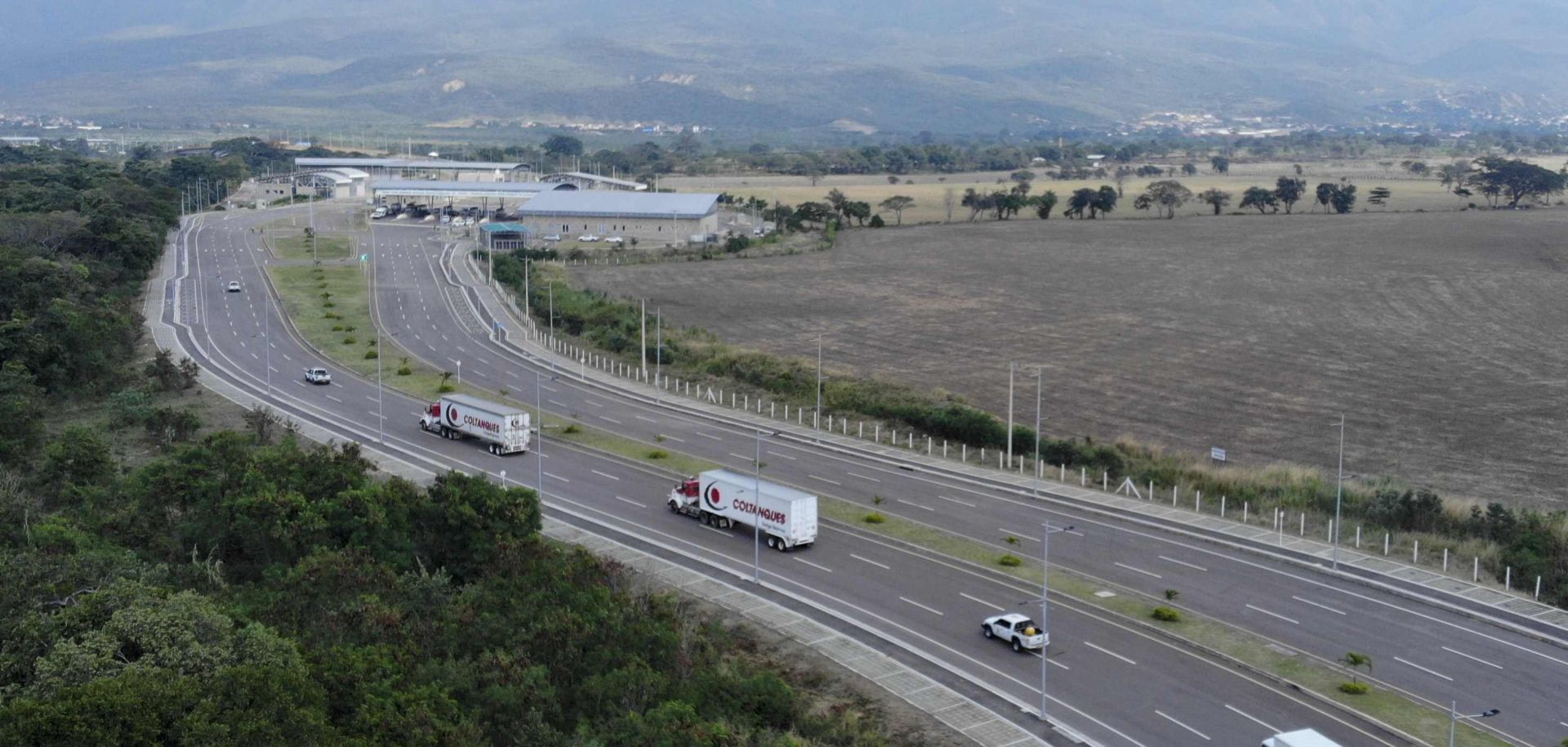 Trucks loaded with humanitarian aid for Venezuela arrive at the border between Colombia and Venezuela on February 7, 2018