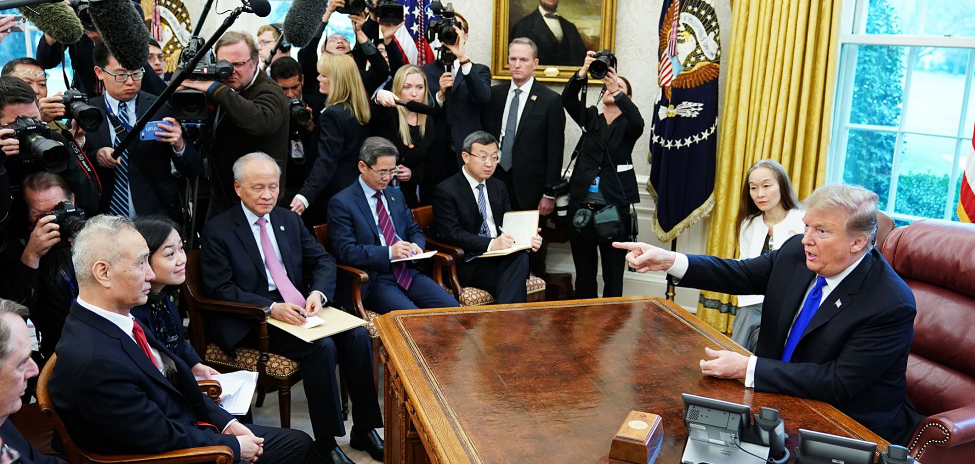 U.S. President Donald Trump takes part in a meeting with China's Vice Premier Liu He (L) in the Oval Office of the White House on Feb. 22.