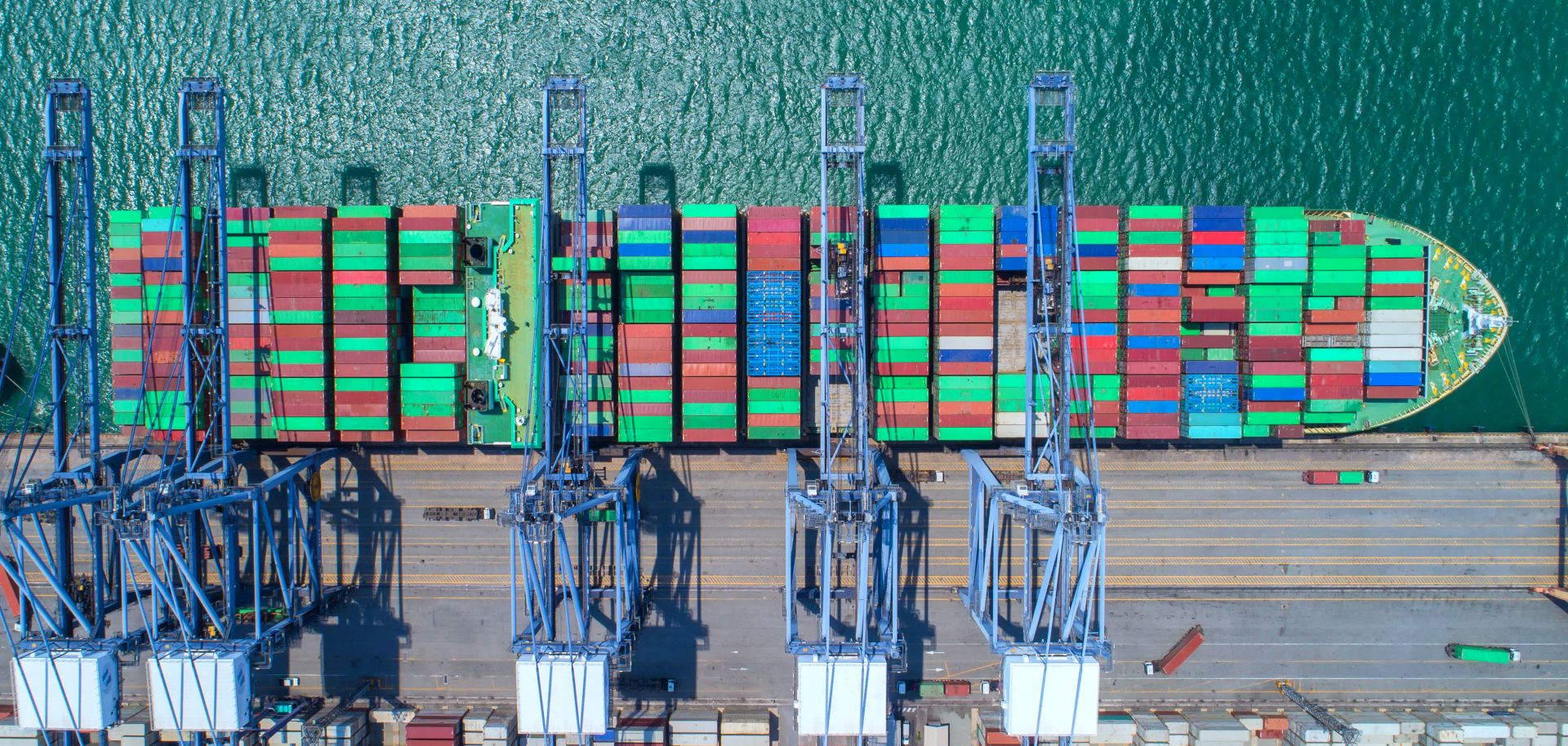 An aerial view of harbored shipping cargo.