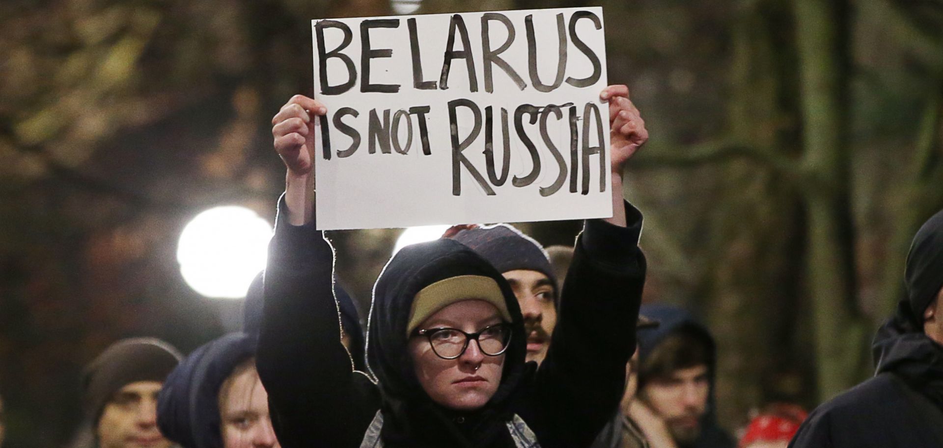 People gather for a rally against Belarus' closer integration with Russia in Minsk's Oktyabrskaya Square on Dec. 20, 2019.