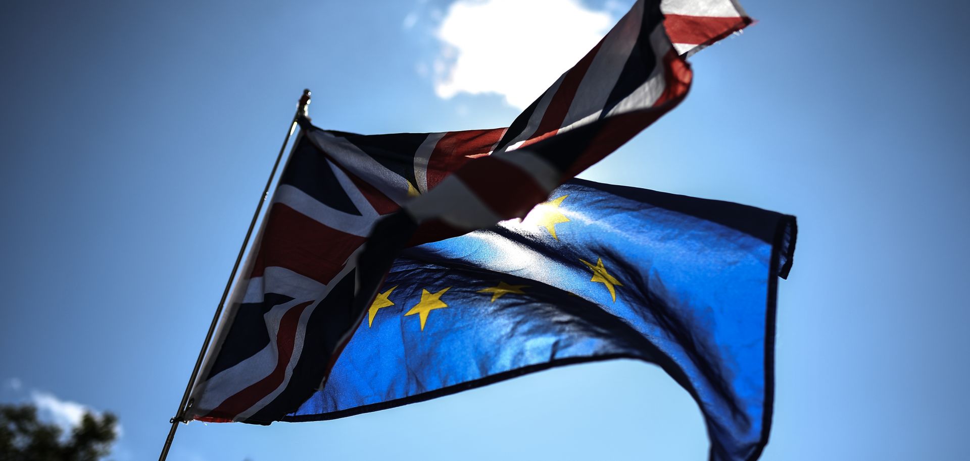 The Union Jack and the European Union flag wave outside the British Cabinet Office in London on Aug. 29, 2019, as protesters rally against Prime Minister Boris Johnson's suspension of Parliament.