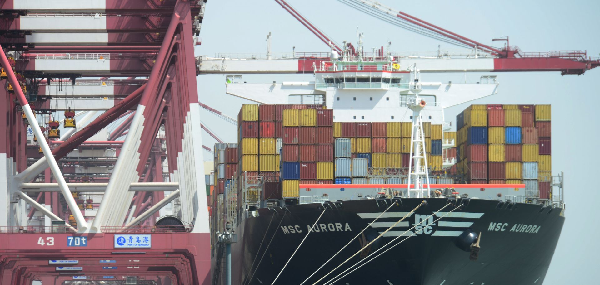 A cargo ship carrying containers stops at Qingdao Port on April 6, 2018, in Qingdao, China.