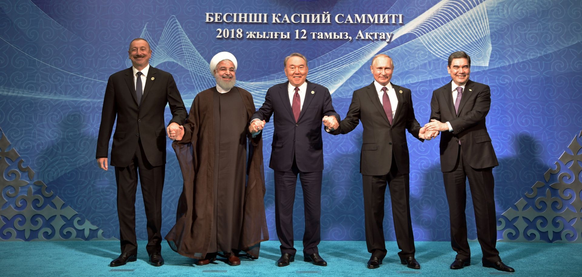 (L-R) Azerbaijan's President Ilham Aliyev, Iranian President Hassan Rouhani, Kazakhstan's President Nursultan Nazarbayev, Russian President Vladimir Putin and Turkmenistan's President Gurbanguly Berdymukhamedov pose after the signing ceremony at the 5th Caspian Summit in Aktau on August 12.