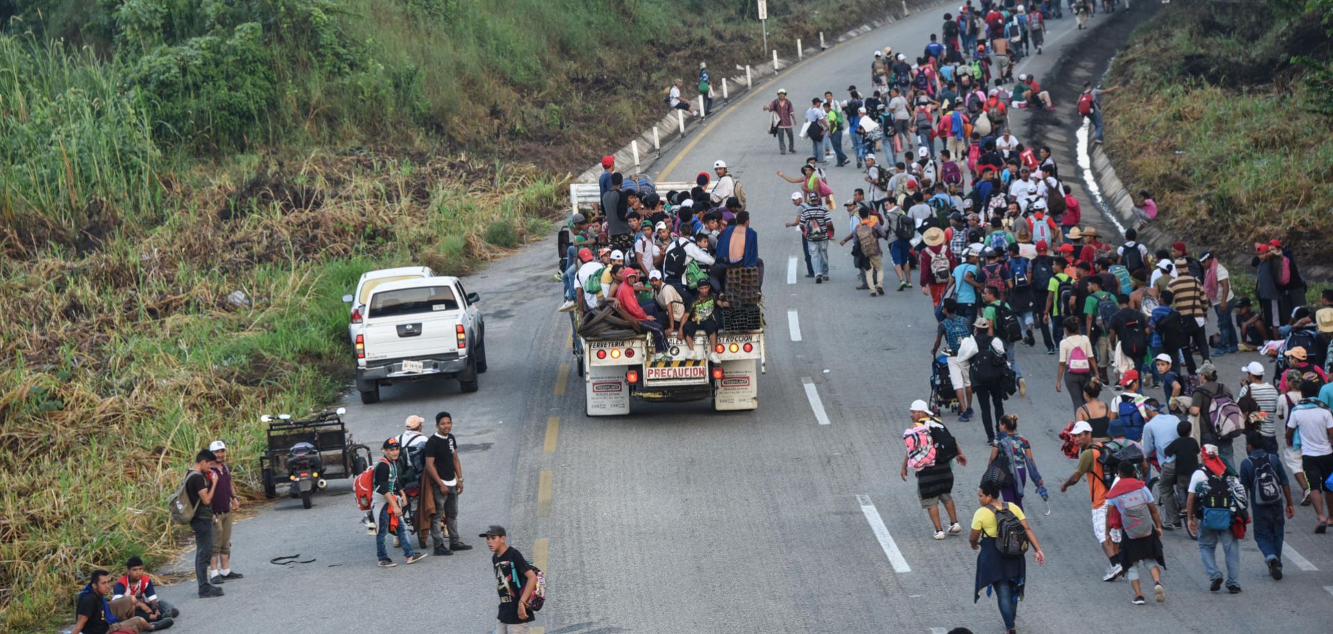 Central American migrants near Huixtla in the Mexican state of Chiapas head toward the United States more than 1,000 miles away on Oct. 24.