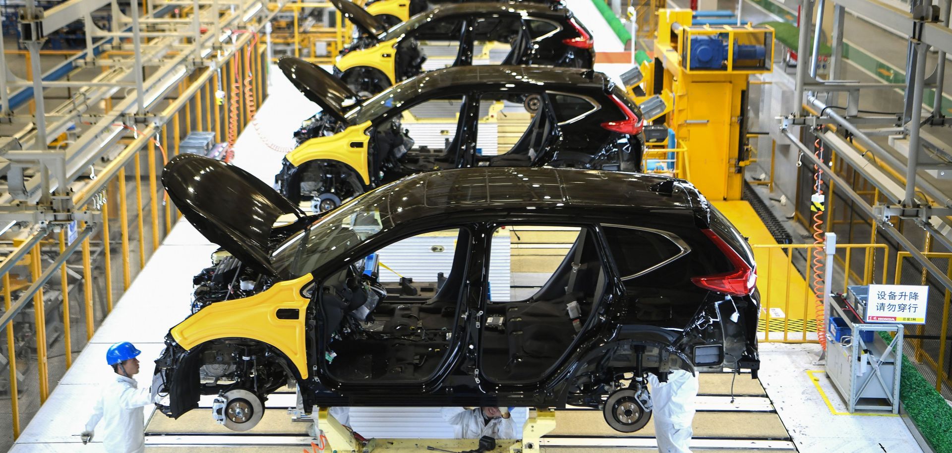 This photo shows workers at Dongfeng Motor's joint venture with Honda in Wuhan, China.