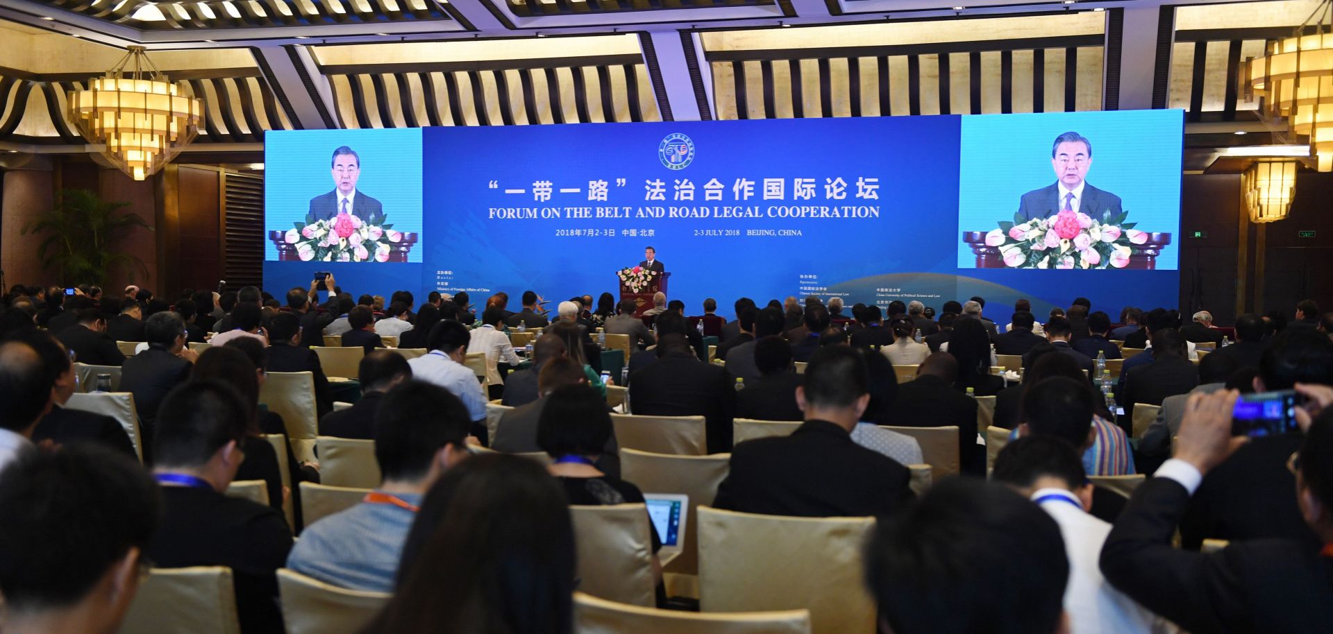 Chinese Foreign Minister Wang Yi speaks during the opening session of the Belt and Road Forum on Legal Cooperation at the Diaoyutai State Guesthouse in Beijing on July 2, 2018.