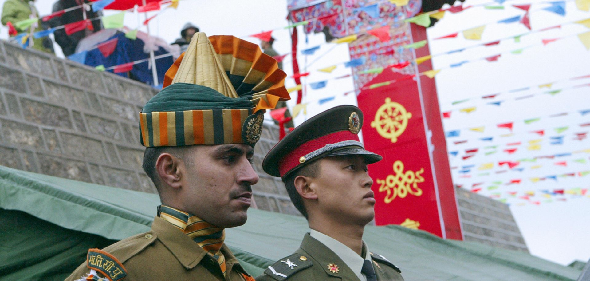 Members of the Chinese and Indian armed forces attend a ceremony marking the opening of the border between India's Sikkim state and Tibet at Nathu La pass in the Himalayas.