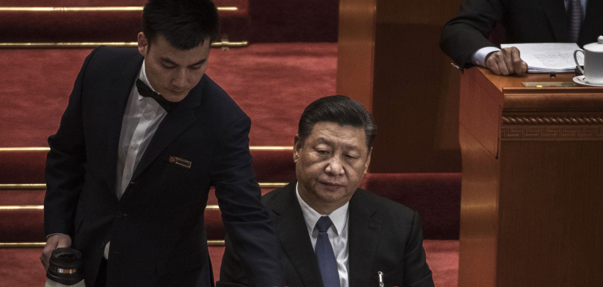 Chinese President Xi Jinping is served tea on March 12, 2019, during a session of the National People's Congress in Beijing.