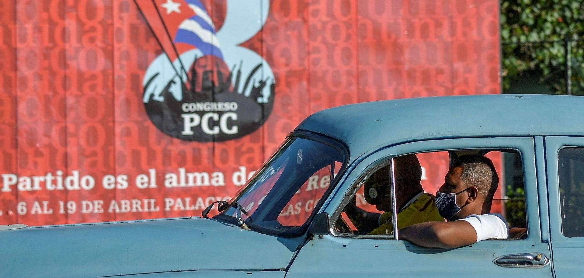 A motorist passes a sign for the 8th Congress of the Cuban Communist Party on April 6, 2021, in Havana.