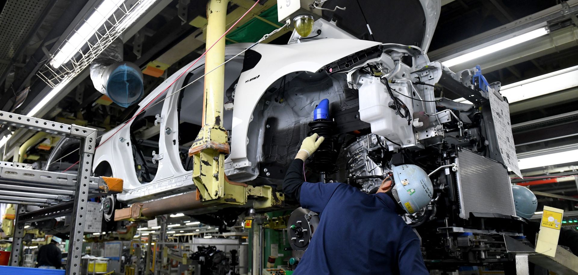 Workers in Toyota City in Japan's Aichi prefecture assemble a Prius. Japan's auto manufacturing sector is heavily export-driven, and the United States is a prime destination for its cars.