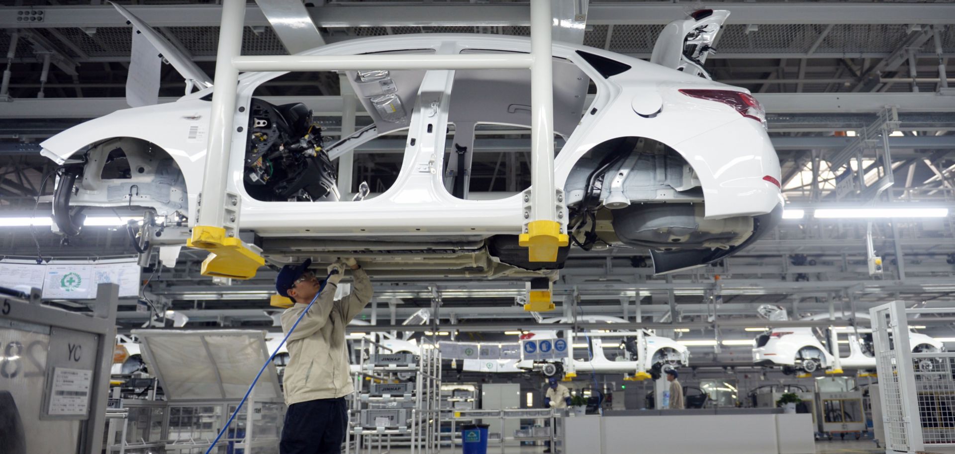 A worker assembles a vehicle in a Hyundai plant in China's Hebei province. South Korean automakers have increased their manufacturing capacity in China to A significant proportion of South Korea's auto manufacturing capacity in China to 2.1 million vehicles annually.