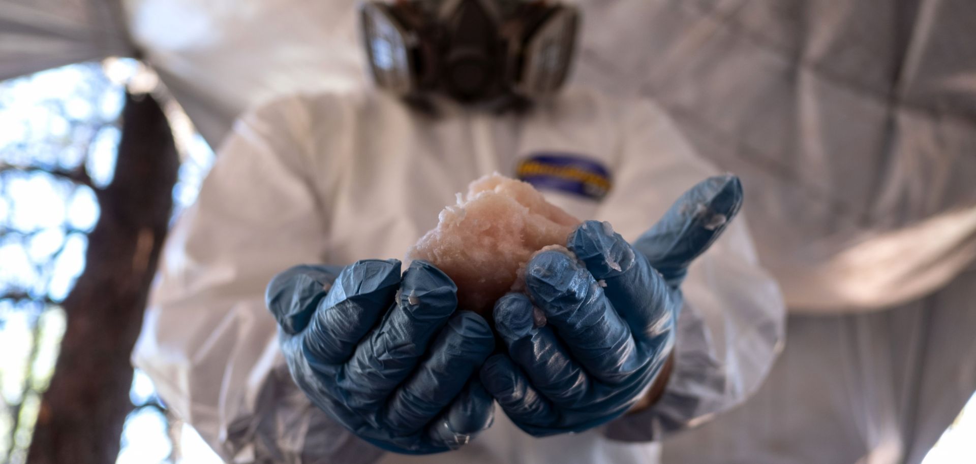 A Mexican Army expert in protective gear displays crystal meth paste at a clandestine laboratory near la Rumorosa town in Tecate, Baja California state, Mexico on Aug. 28.