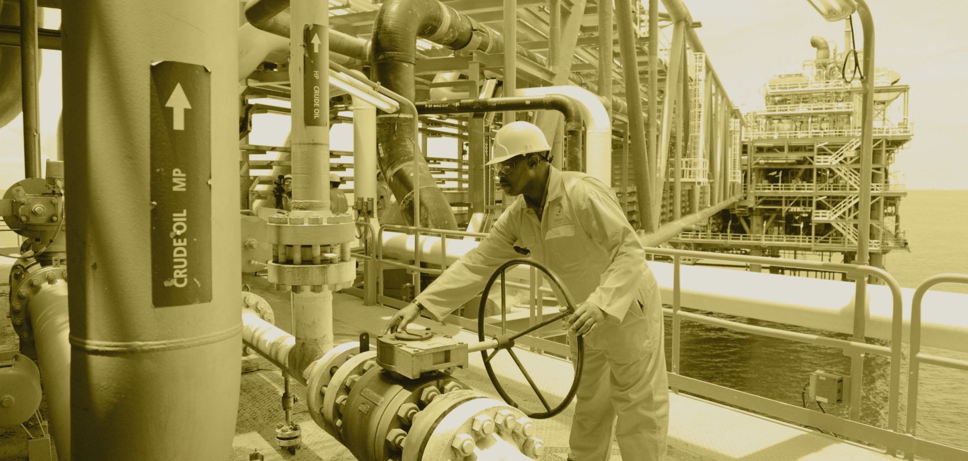 A worker inspects a Total oil drilling platform near Port Harcourt in the Niger Delta.
