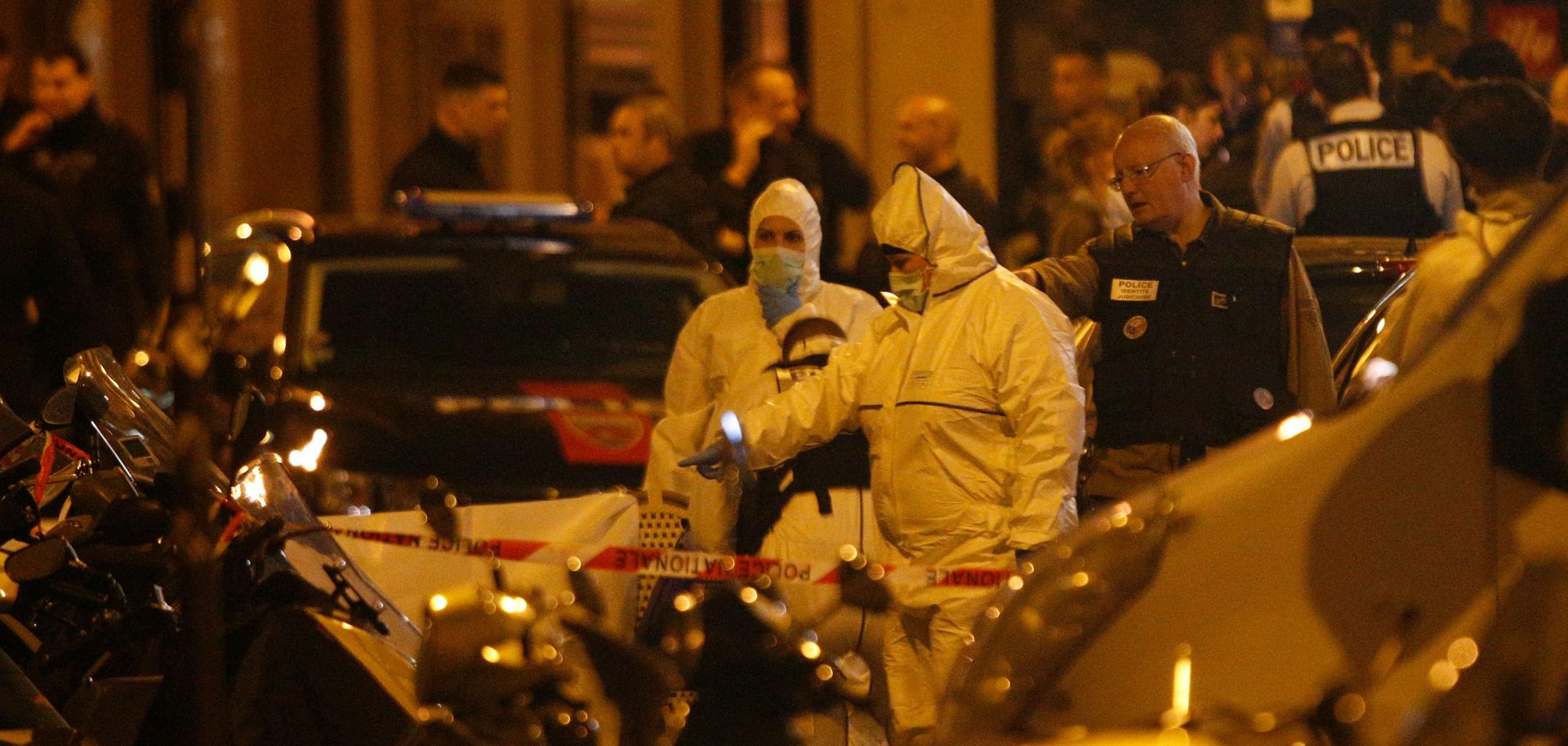 In this photograph, French police inspect the scene after a man armed with a knife was shot dead after he killed on person and injured several others in Paris on May, 12, 2018.