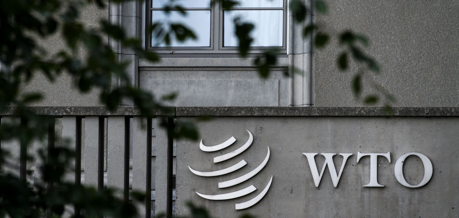 A sign of the World Trade Organization (WTO) is seen at the body's headquarters in Geneva on Sept. 21.