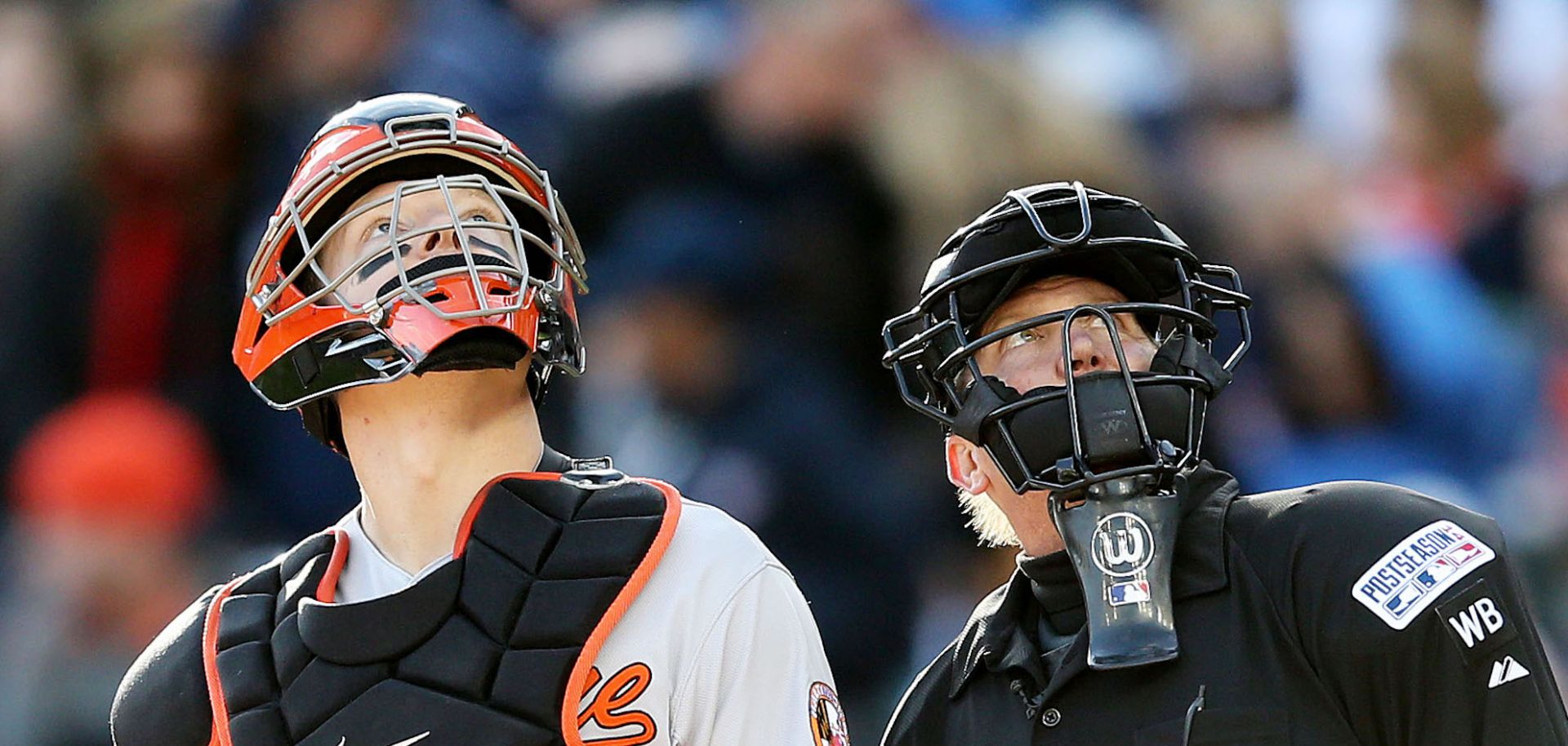 Baseball player Nick Hundley and umpire Jeff Kellogg watch a drone flying over Detroit's Comerica Park in 2014.