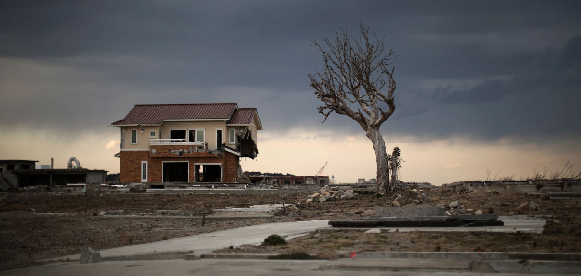 A lone house sits on the scarred landscape, inside the exclusion zone, close to the devastated Fukushima Dai-ichi nuclear plant in Japan. More than six years after the disaster, Japan is apparently on its way to restoring nuclear energy as one of the major sources of electric power.