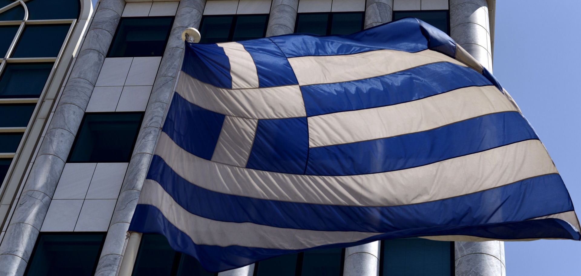 The Greek flag flies just outside the country's stock exchange.