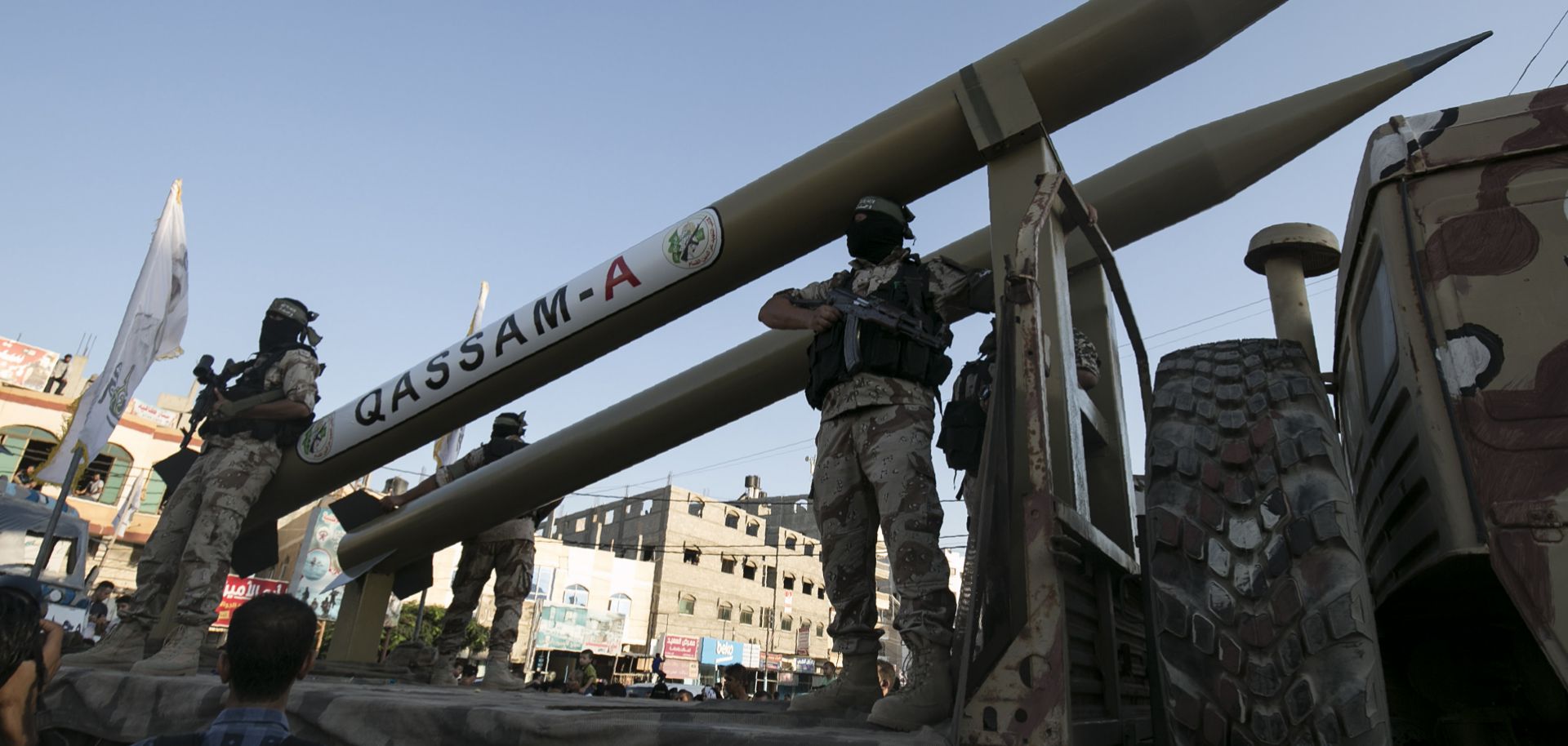 Palestinians from the armed wing of the Hamas movement, display Qassam home-made rockets during an anti-Israel military parade in Rafah in the southern Gaza Strip, Aug. 21, 2016.