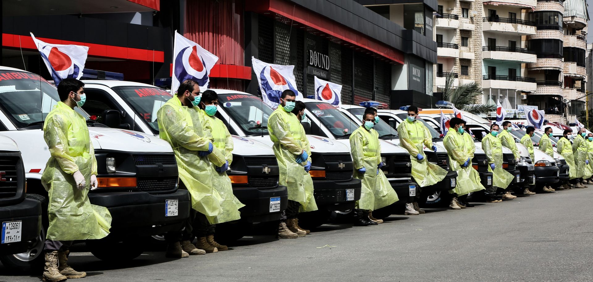 Members of Hezbollah’s medical apparatus wear full protective gear in Beirut, Lebanon, to demonstrate their readiness for the COVID-19 fight on March 31, 2020.