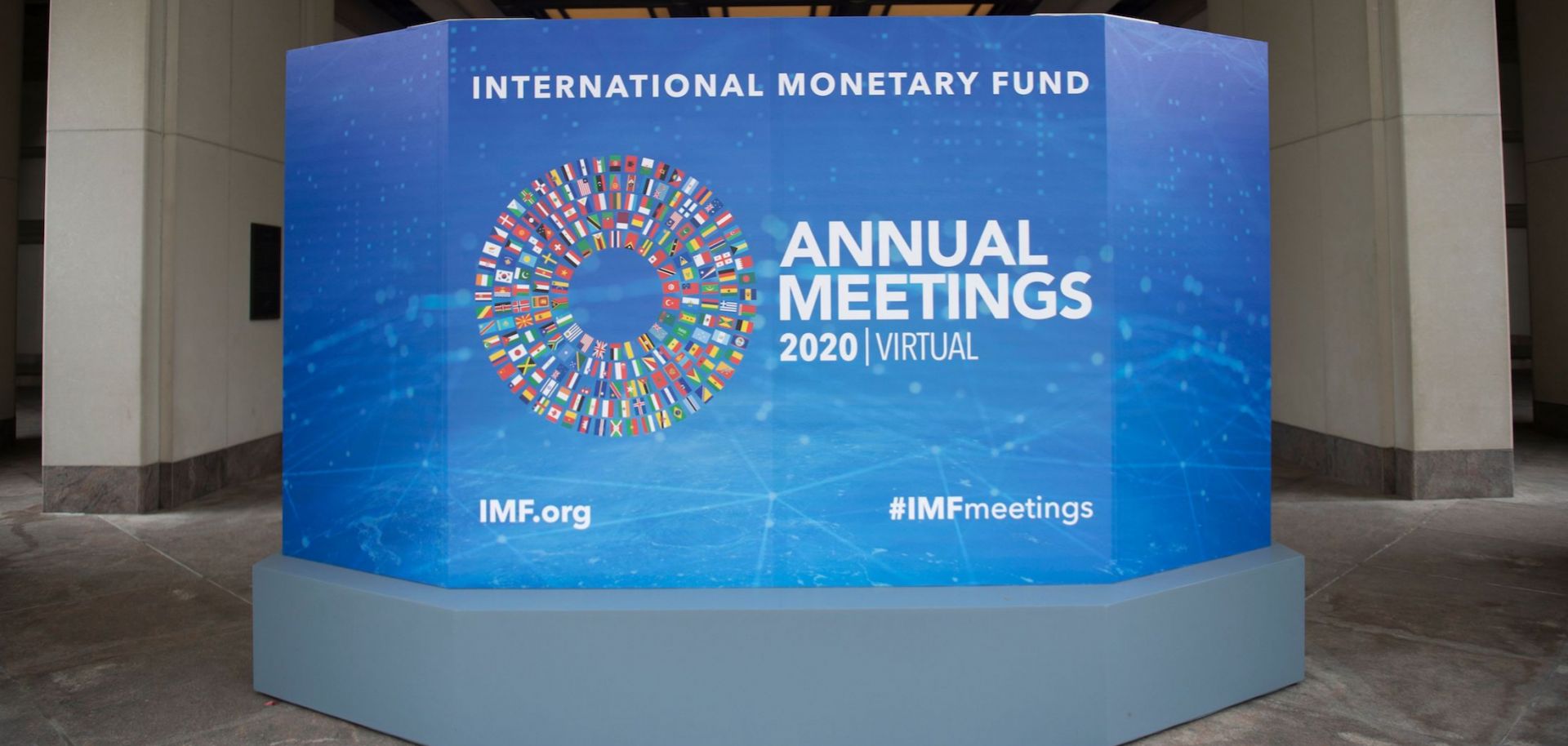 A promotional board for the annual series of meetings between the International Monetary Fund (IMF) and the World Bank is seen outside the IMF headquarters in Washington D.C. on Oct. 13, 2020.