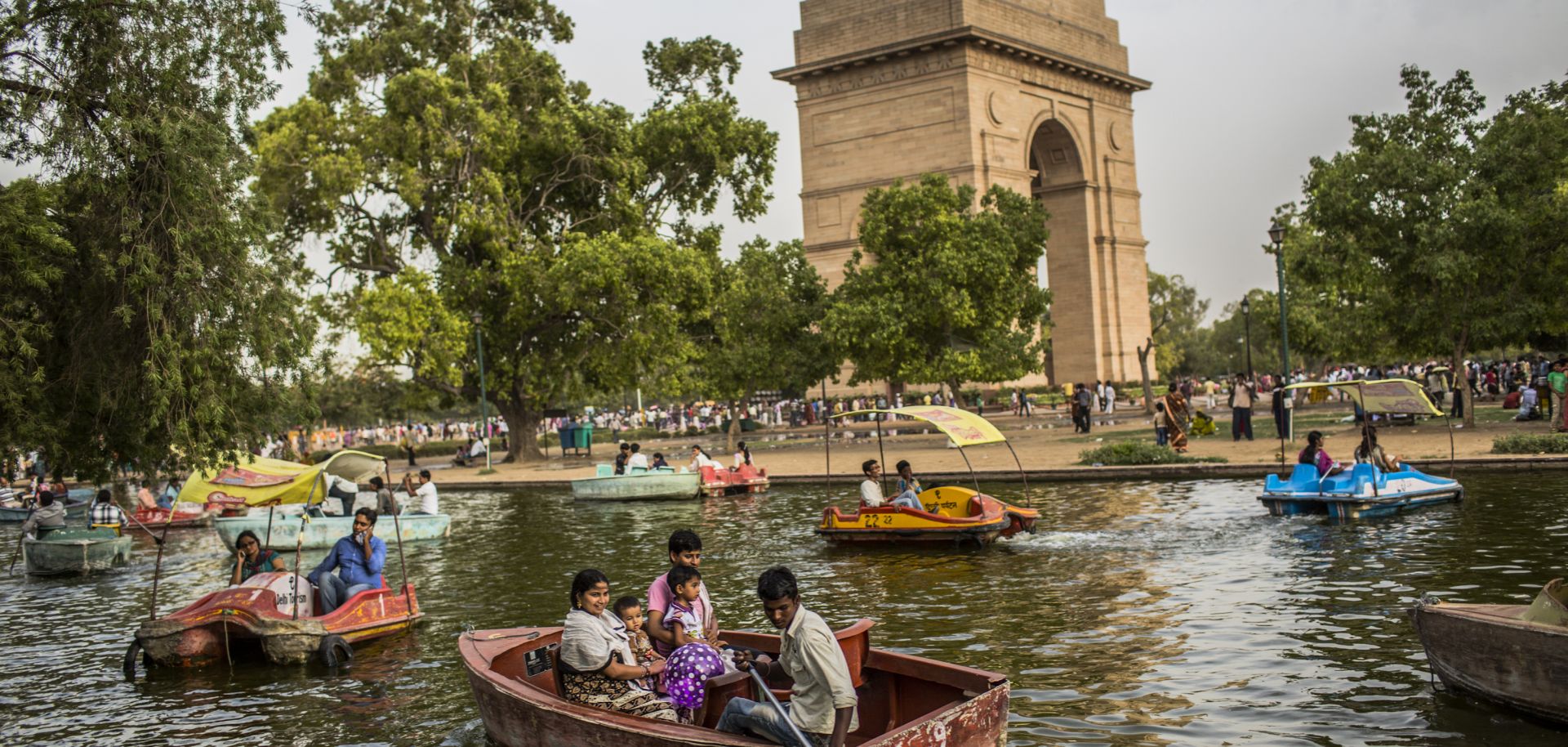 Families in New Dehli take a boat ride during a heat wave.