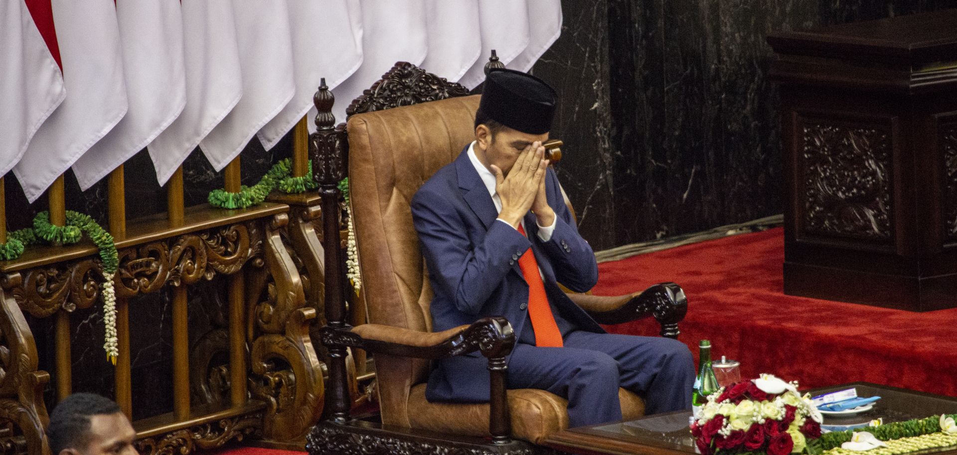 Indonesian President Joko "Jokowi" Widodo prays during his inauguration for his second term on Oct. 20, 2019, in Jakarta.