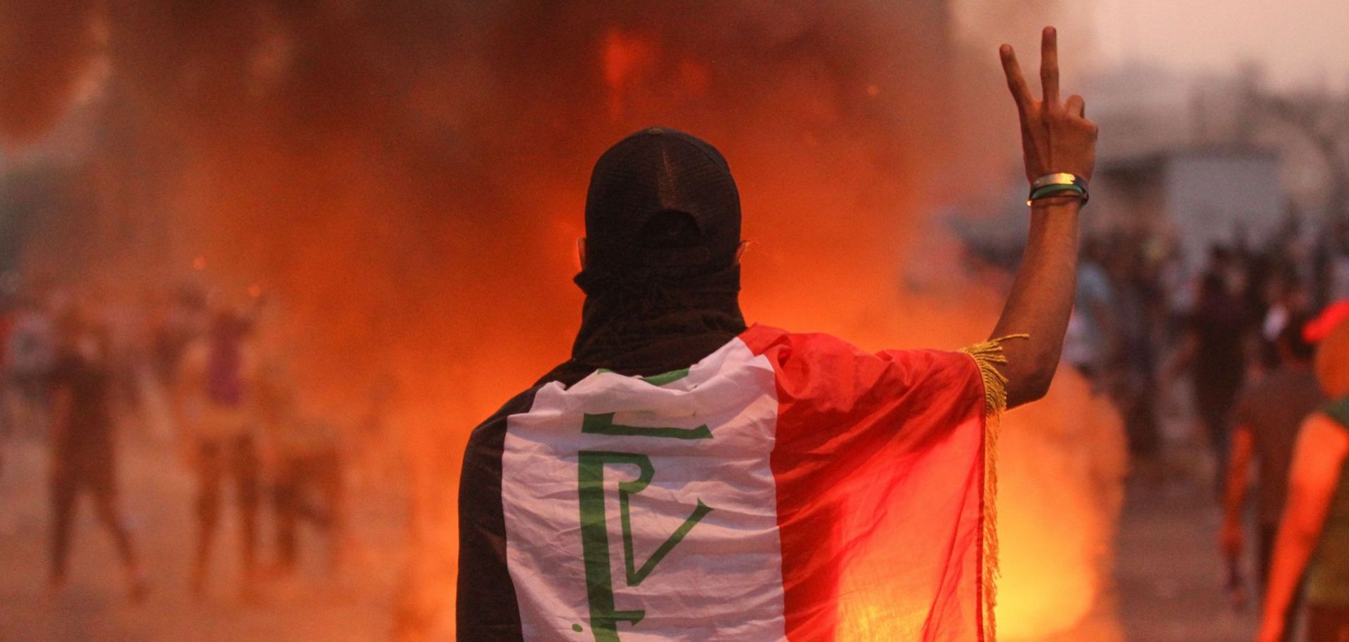 In this photo, an Iraqi protester flashes the V sign during an anti-government demonstration in Baghdad on Oct. 2, 2019.